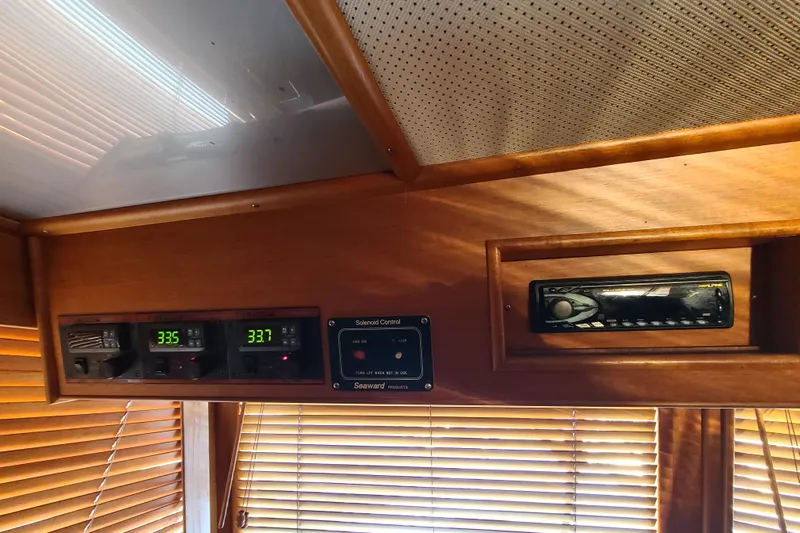 Breakaway Yacht Photos Pics Interior of 2000 Grand Banks 46 Classic yacht with control panel and stereo system.