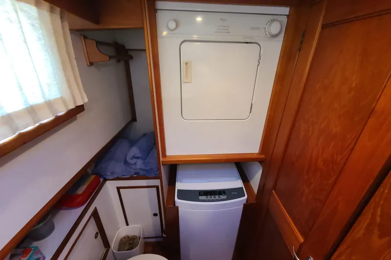 Breakaway Yacht Photos Pics Laundry area in 2000 Grand Banks 46 Classic yacht with washer and dryer.