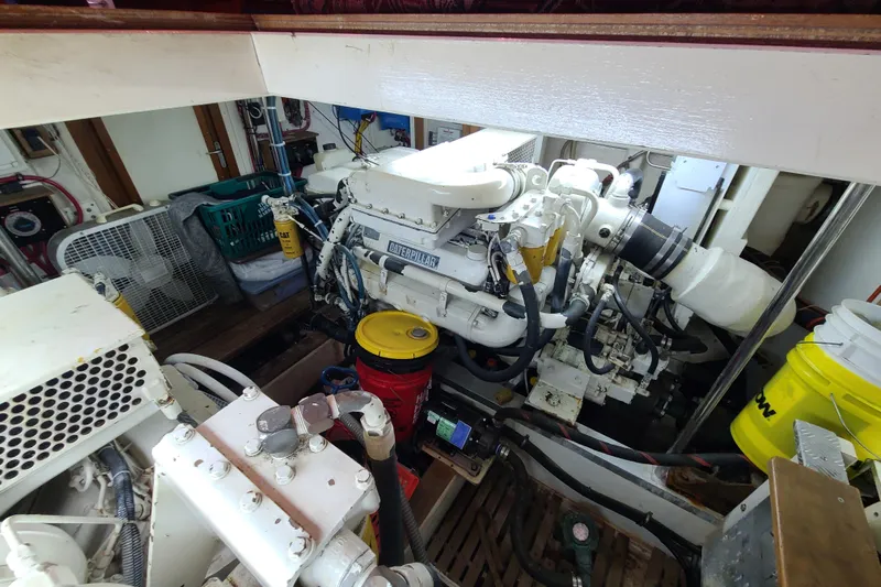Breakaway Yacht Photos Pics Engine room of a 2000 Grand Banks 46 Classic yacht, featuring a Caterpillar engine.