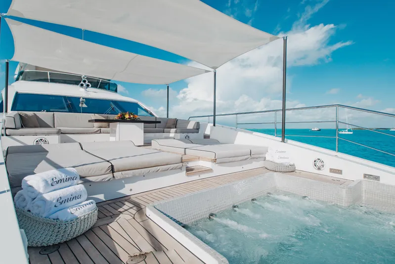Emina Yacht Photos Pics Luxurious 2014 Benetti Veloce 140 yacht deck with jacuzzi and sun loungers under canopy.
