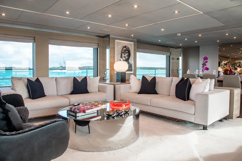 Emina Yacht Photos Pics Luxurious interior of 2014 Benetti Veloce 140 yacht with elegant seating and ocean view.