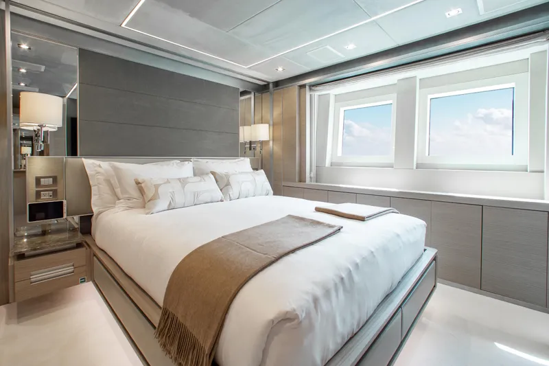 Emina Yacht Photos Pics Luxurious bedroom interior on 2014 Benetti Veloce 140 yacht, featuring modern design and large windows.