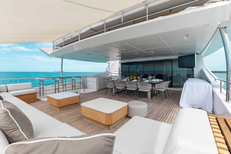 Emina Yacht Photos Pics Luxurious 2014 Benetti Veloce 140 yacht deck with elegant seating and dining area.