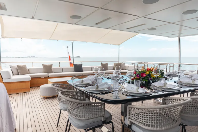Emina Yacht Photos Pics Luxurious dining area on 2014 Benetti Veloce 140 yacht with ocean view.