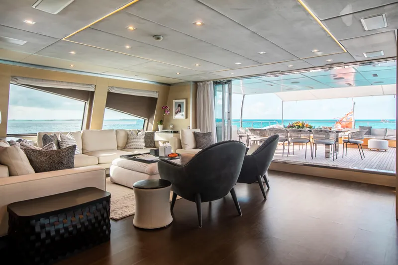 Emina Yacht Photos Pics Luxurious interior of 2014 Benetti Veloce 140 yacht with ocean view and elegant seating.