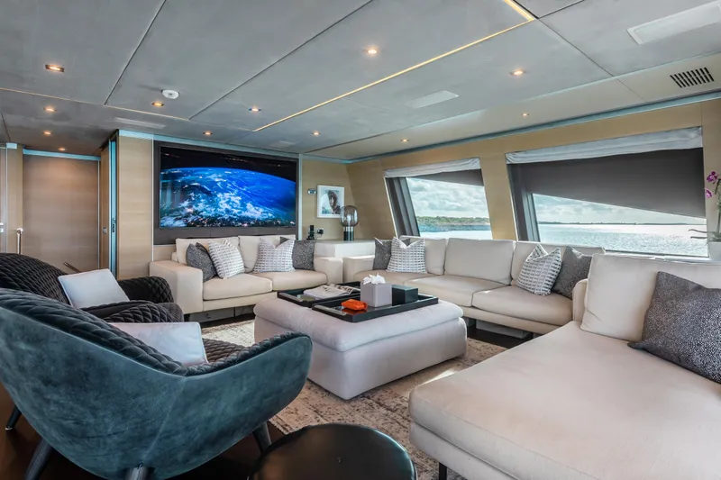 Emina Yacht Photos Pics Luxurious interior of 2014 Benetti Veloce 140 yacht with plush seating and large windows.