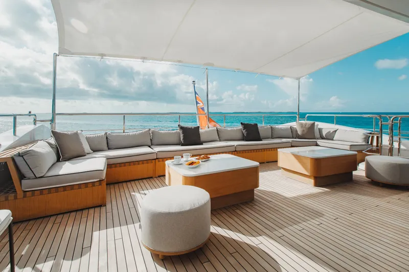 Emina Yacht Photos Pics Luxurious deck of 2014 Benetti Veloce 140 yacht with elegant seating and ocean view.