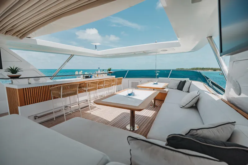 Emina Yacht Photos Pics Luxurious 2014 Benetti Veloce 140 yacht deck with elegant seating and ocean view.