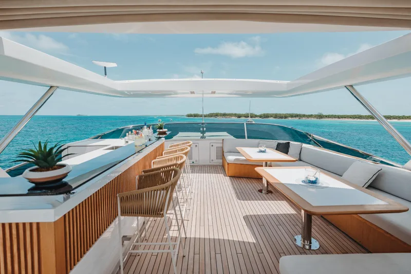 Emina Yacht Photos Pics Luxurious 2014 Benetti Veloce 140 yacht deck with bar and seating, overlooking ocean.