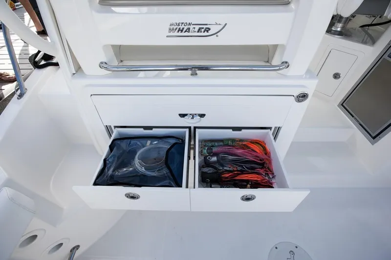  Yacht Photos Pics 2019 Boston Whaler 315 Conquest storage drawers with organized equipment.