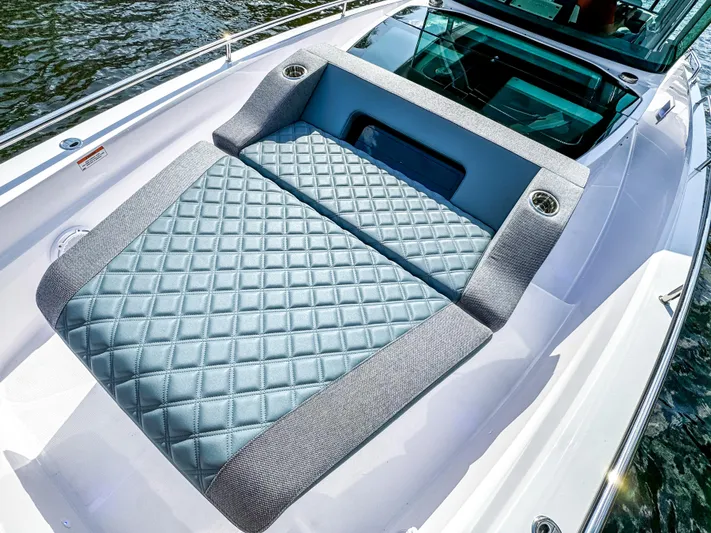  Yacht Photos Pics Luxurious seating on 2024 Axopar 37XC CROSS CABIN boat, featuring quilted upholstery.