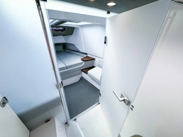  Yacht Photos Pics 2024 Axopar 37XC CROSS CABIN interior with modern, sleek design and comfortable sleeping area.