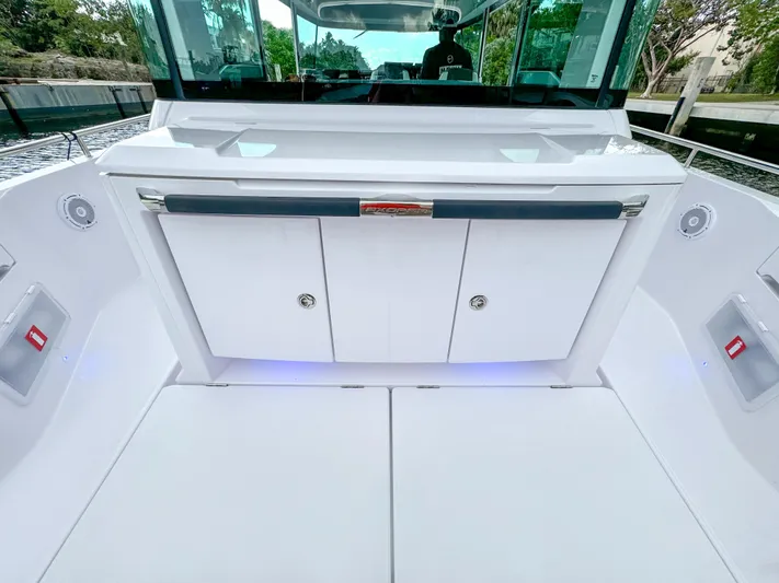  Yacht Photos Pics 2024 Axopar 37XC CROSS CABIN boat interior with sleek white cabinetry and modern design.