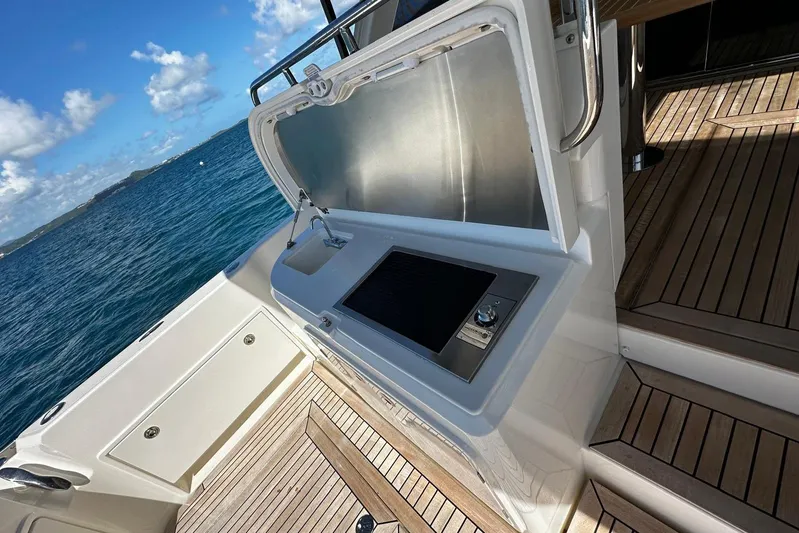  Yacht Photos Pics Outdoor kitchenette on 2023 Riviera 465 SUV yacht with ocean view.