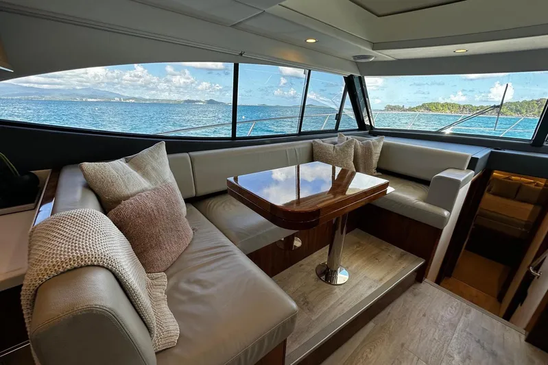  Yacht Photos Pics Luxurious interior of 2023 Riviera 465 SUV yacht with ocean view.