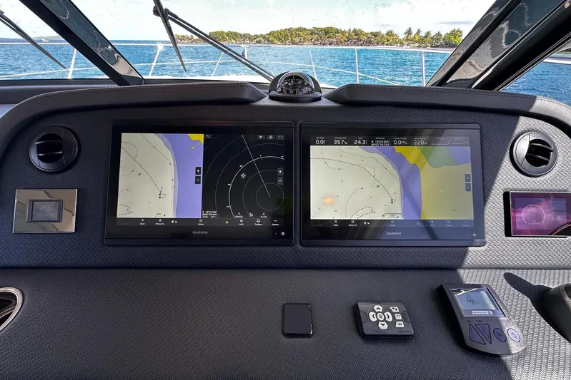  Yacht Photos Pics Cockpit of 2023 Riviera 465 SUV with dual Garmin navigation screens.