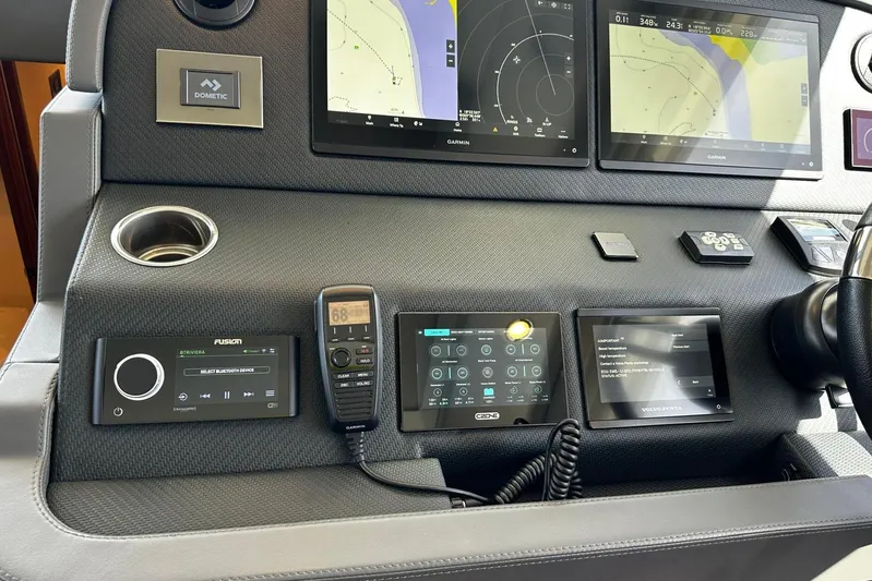  Yacht Photos Pics Control panel of 2023 Riviera 465 SUV with navigation and communication systems.