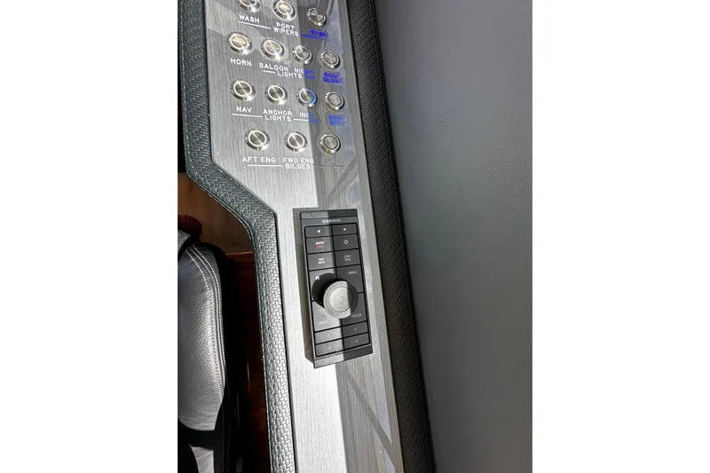  Yacht Photos Pics Control panel of 2023 Riviera 465 SUV with buttons and navigation controls.