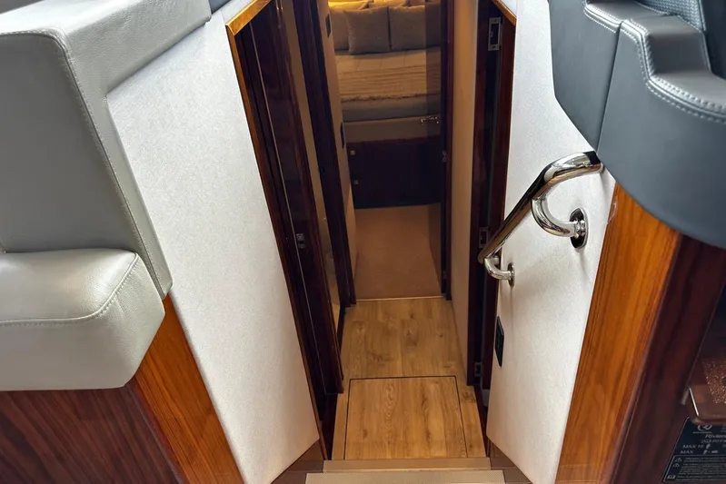  Yacht Photos Pics Interior view of 2023 Riviera 465 SUV yacht, featuring a sleek hallway and modern design.