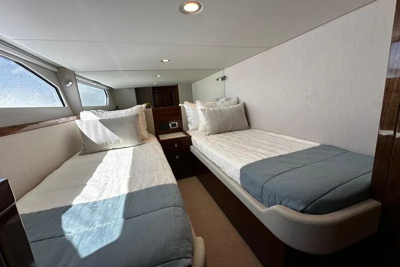  Yacht Photos Pics Luxurious twin cabin interior of 2023 Riviera 465 SUV yacht.