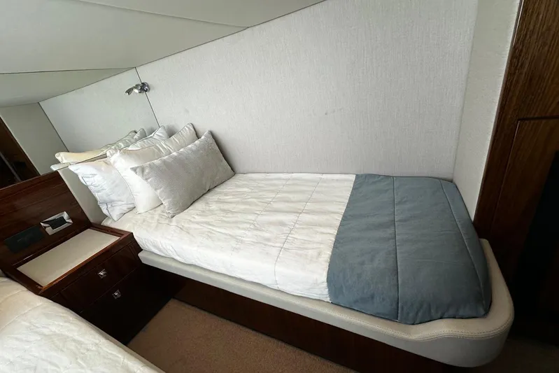  Yacht Photos Pics Luxurious cabin bed in 2023 Riviera 465 SUV yacht interior.