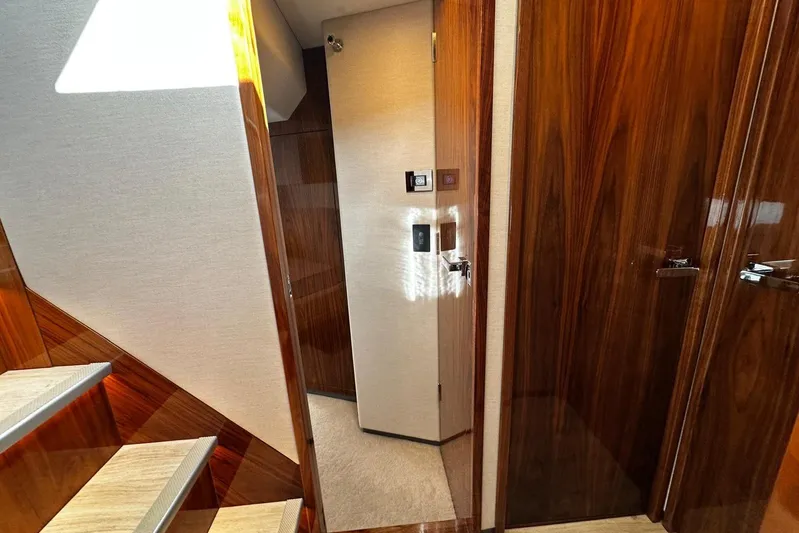  Yacht Photos Pics Interior of 2023 Riviera 465 SUV yacht with polished wood finishes and modern design.