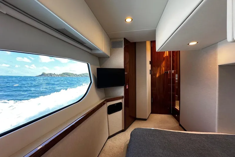  Yacht Photos Pics Luxurious interior of 2023 Riviera 465 SUV yacht with ocean view and modern amenities.