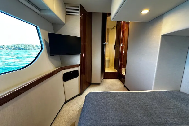  Yacht Photos Pics Interior of 2023 Riviera 465 SUV yacht with window view and modern amenities.