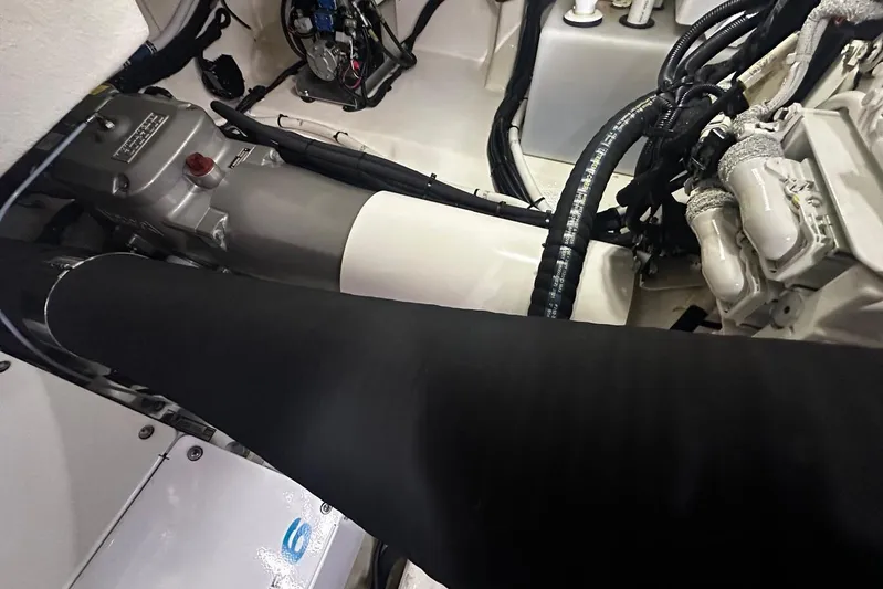  Yacht Photos Pics Engine compartment of 2023 Riviera 465 SUV, showcasing mechanical components and wiring.