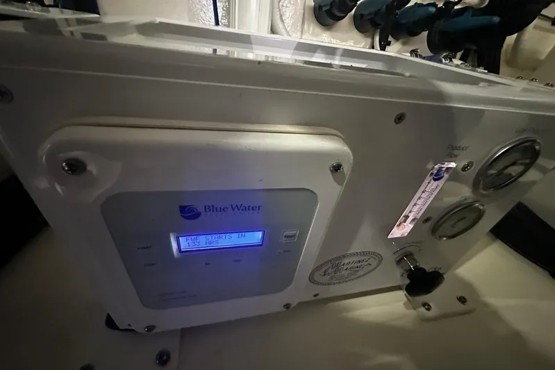  Yacht Photos Pics Control panel of a 2023 Riviera 465 SUV with Blue Water display and gauges.