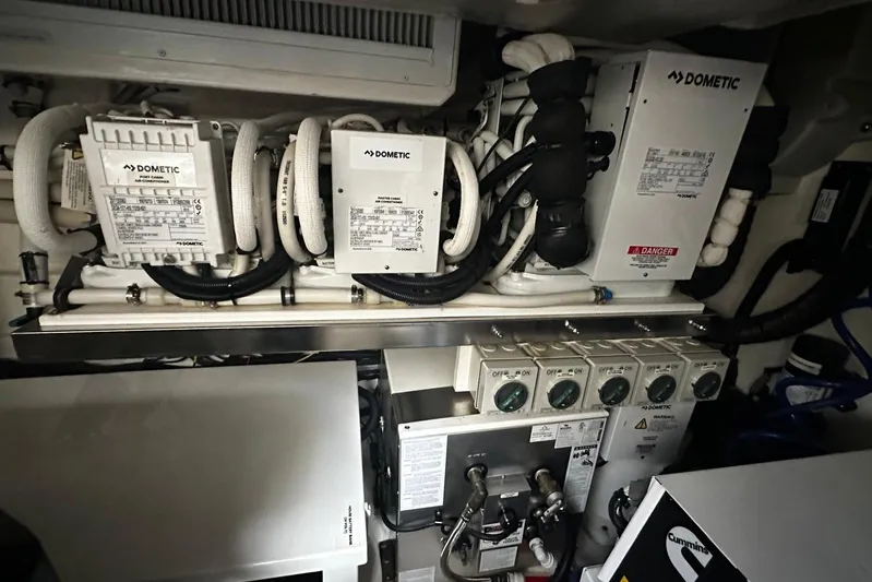  Yacht Photos Pics Engine room of 2023 Riviera 465 SUV with Dometic systems and control panels.