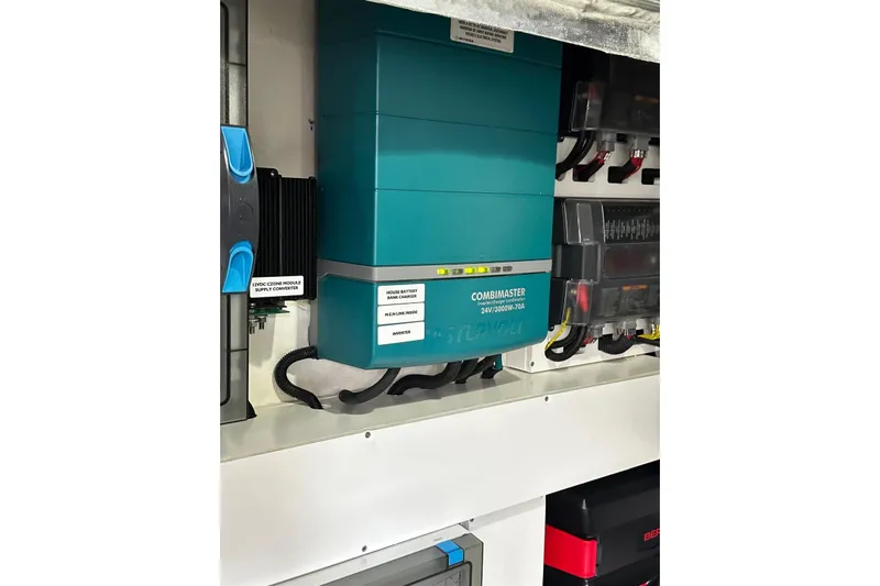  Yacht Photos Pics Electrical system components in a 2023 Riviera 465 SUV, featuring a CombiMaster inverter.