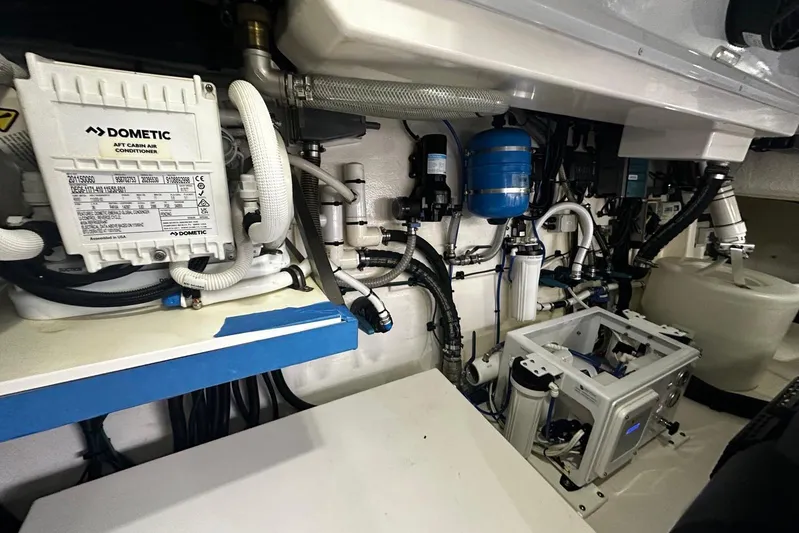  Yacht Photos Pics Engine room of 2023 Riviera 465 SUV, showcasing air conditioning and mechanical systems.