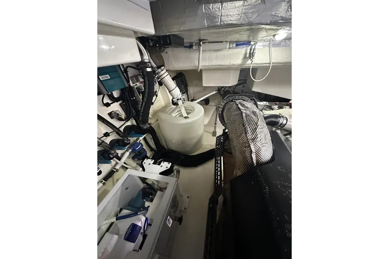  Yacht Photos Pics Engine room of 2023 Riviera 465 SUV, showcasing mechanical components and systems.