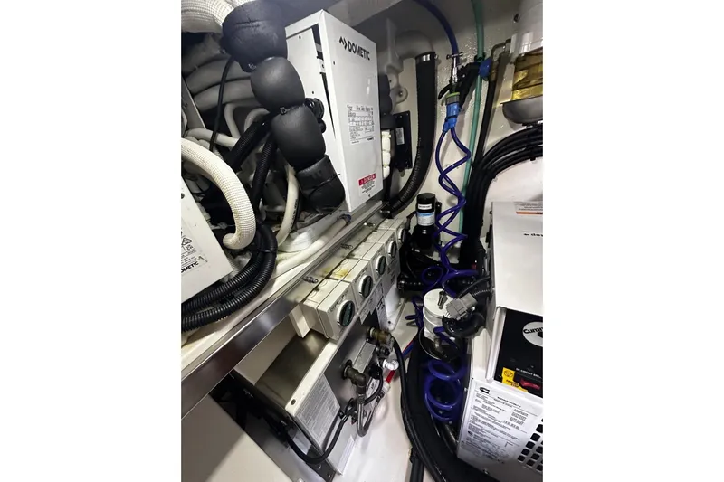  Yacht Photos Pics Engine room of 2023 Riviera 465 SUV with complex wiring and equipment.