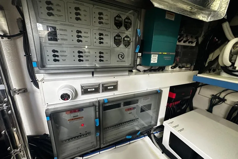  Yacht Photos Pics Electrical control panel in 2023 Riviera 465 SUV yacht engine room.