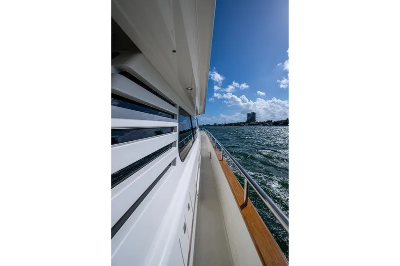 The Usual Yacht Photos Pics Side view of Horizon 82 yacht cruising on a sunny day, 2000 model.