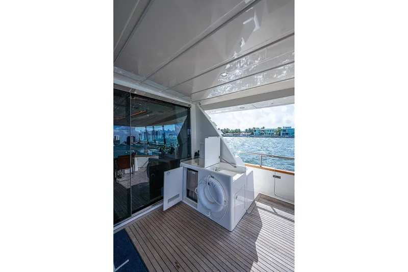 The Usual Yacht Photos Pics Outdoor deck of 2000 Horizon 82 yacht with ocean view and life preserver.