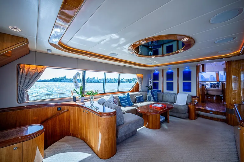 The Usual Yacht Photos Pics Luxurious interior of 2000 Horizon 82 yacht with elegant seating and panoramic windows.