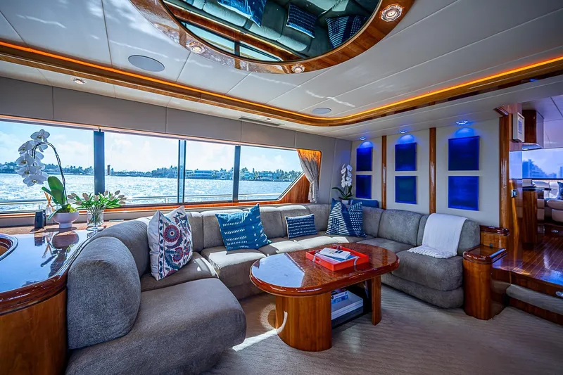 The Usual Yacht Photos Pics Luxurious Horizon 82 yacht interior with elegant seating, wooden accents, and scenic ocean views.