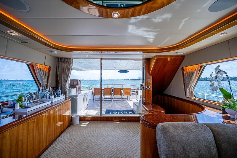 The Usual Yacht Photos Pics Luxurious Horizon 82 yacht interior with elegant wood finishes and ocean view, year 2000 model.