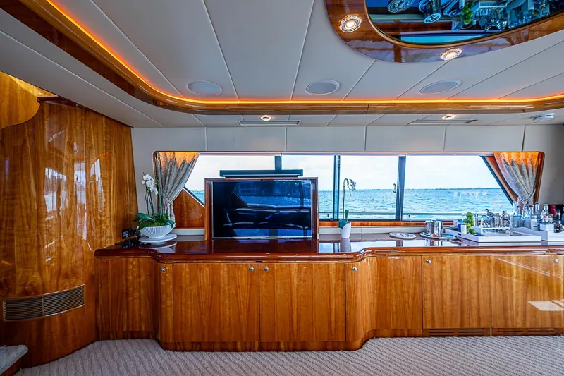 The Usual Yacht Photos Pics Luxurious interior of 2000 Horizon 82 yacht with elegant wood finish and ocean view.