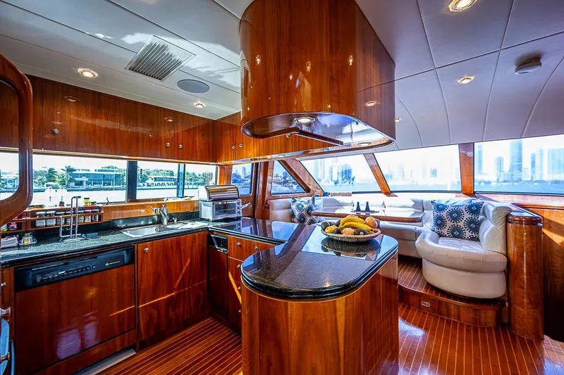 The Usual Yacht Photos Pics Luxurious Horizon 82 yacht interior with elegant wood finishes and modern kitchen, year 2000 model.