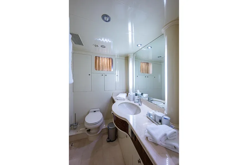 The Usual Yacht Photos Pics Luxurious bathroom in 2000 Horizon 82 yacht with modern fixtures and elegant design.