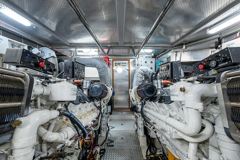 The Usual Yacht Photos Pics Engine room of 2000 Horizon 82 yacht with Caterpillar marine engines.