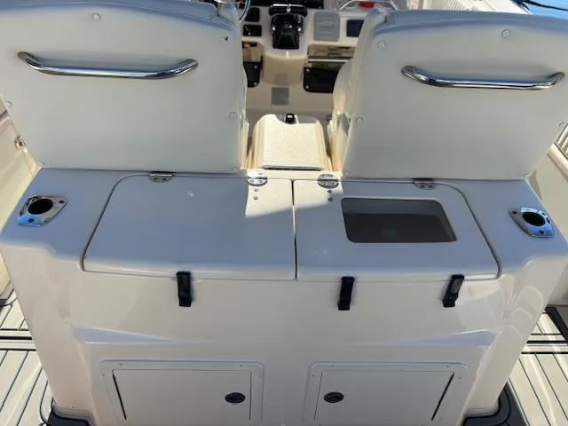 Get Hot Yacht Photos Pics 2011 Grady-White Canyon 306 boat interior with dual seats and storage compartments.