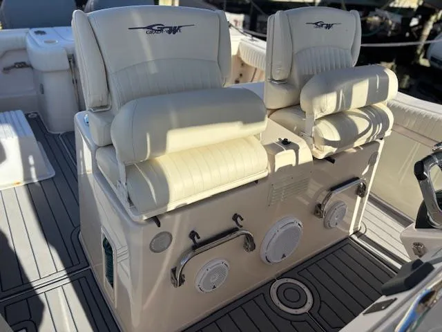 Get Hot Yacht Photos Pics Grady-White Canyon 306 boat interior, featuring cushioned seating and sleek design, 2011 model.