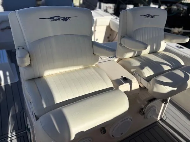 Get Hot Yacht Photos Pics Grady-White Canyon 306 boat seats, 2011 model, featuring white cushioned design.