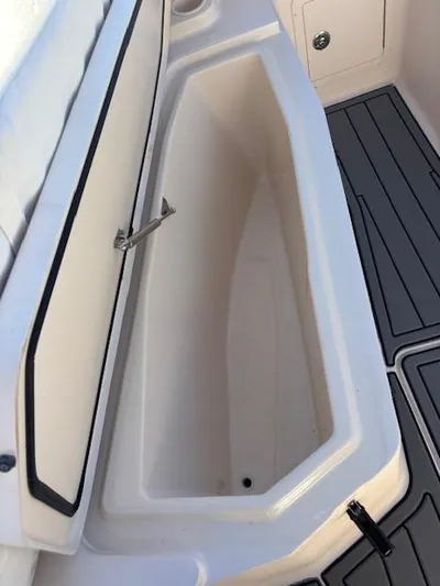 Get Hot Yacht Photos Pics 2011 Grady-White Canyon 306 boat storage compartment with open lid.