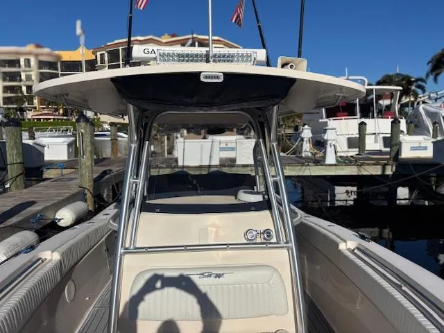 Get Hot Yacht Photos Pics 2011 Grady-White Canyon 306 boat docked at marina under clear blue sky.